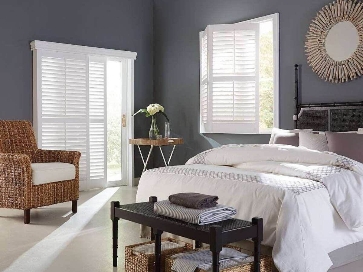 White Bi-Fold Shutters in a bedroom